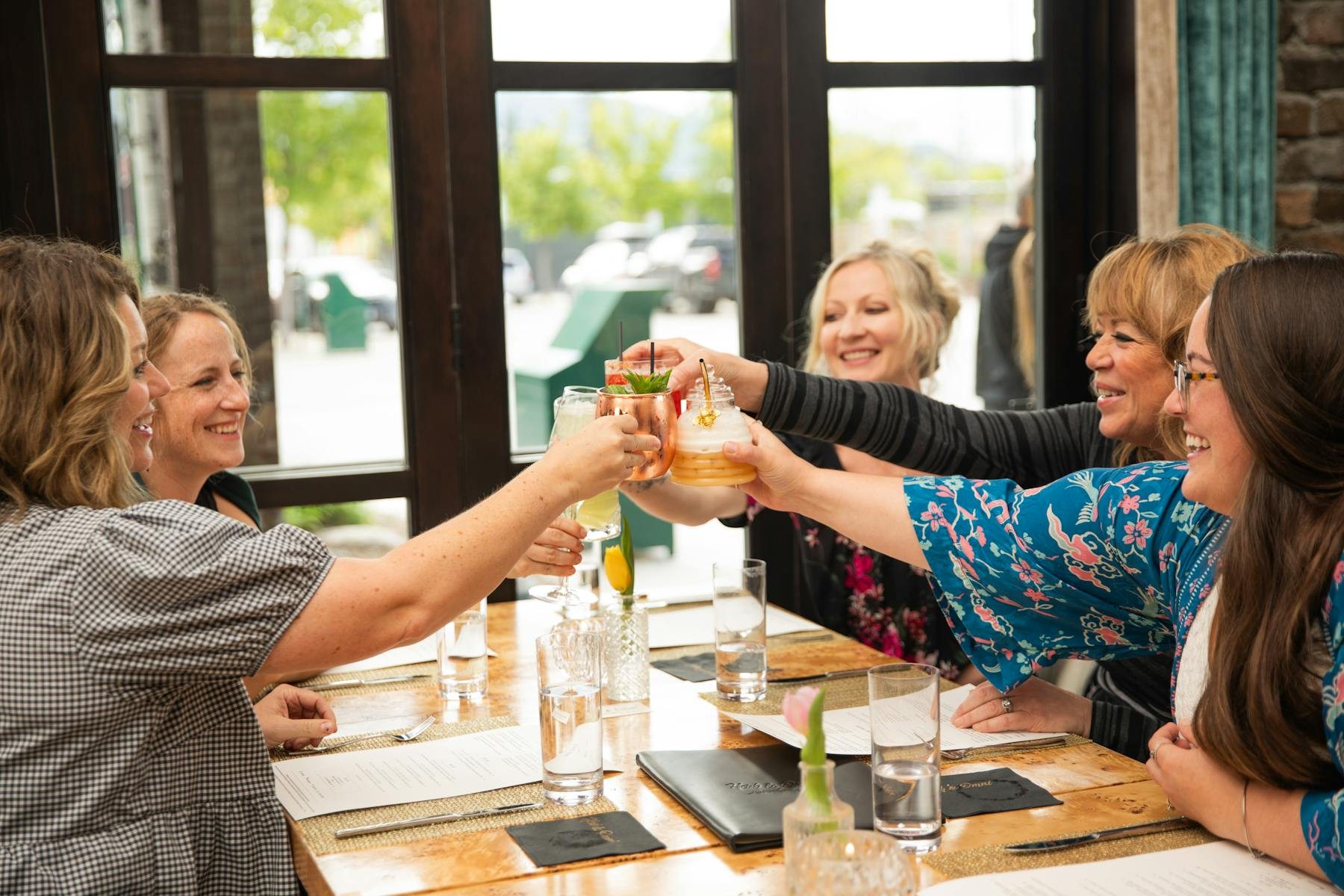 Guests raising glasses at a table at 101 Central
